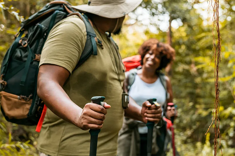 happy plus size couple hiking